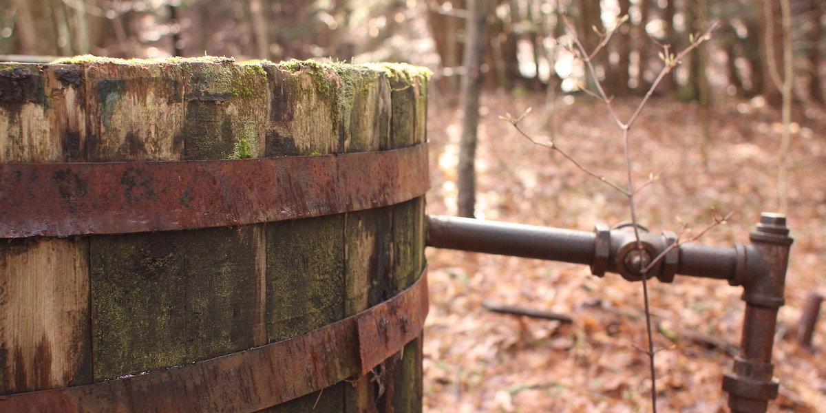 Very old, yet still intact, oil storage container