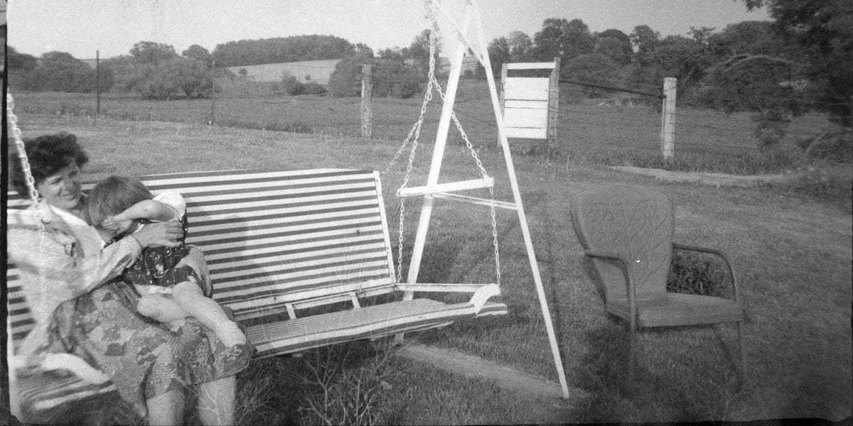 Woman and child on a swing